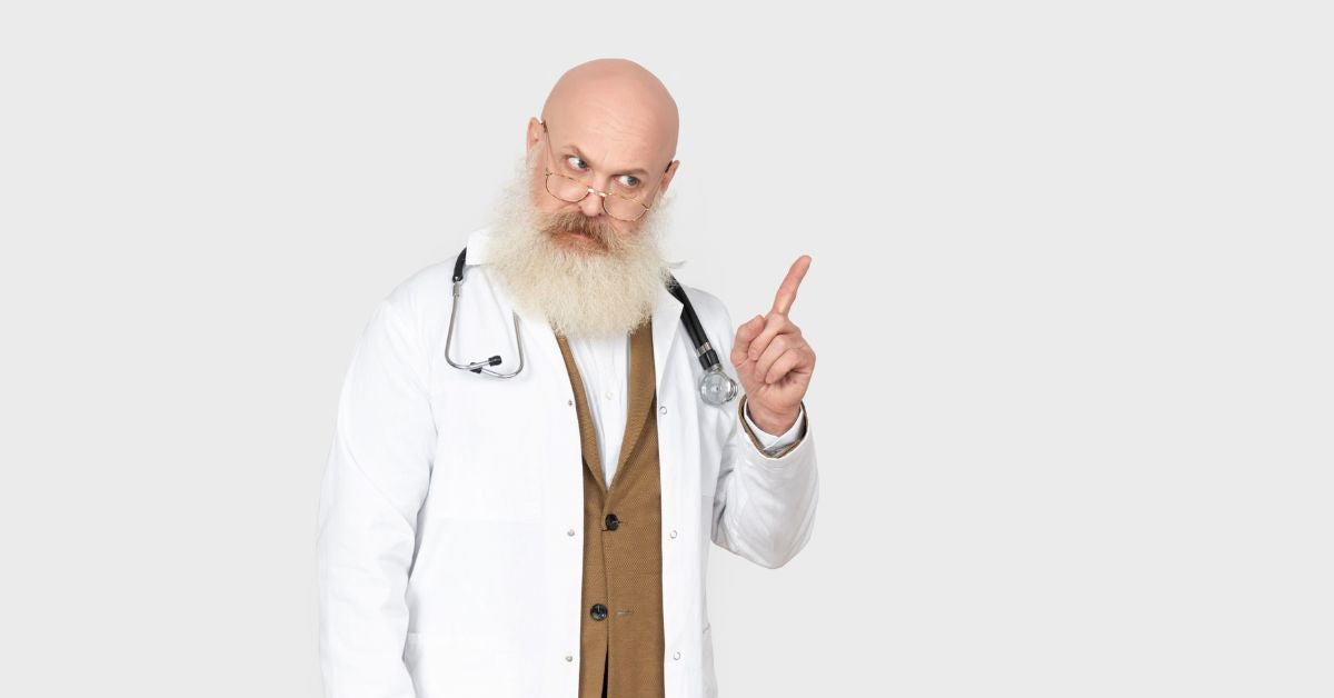 Doctor holding finger up while giving advice about THC health and safety