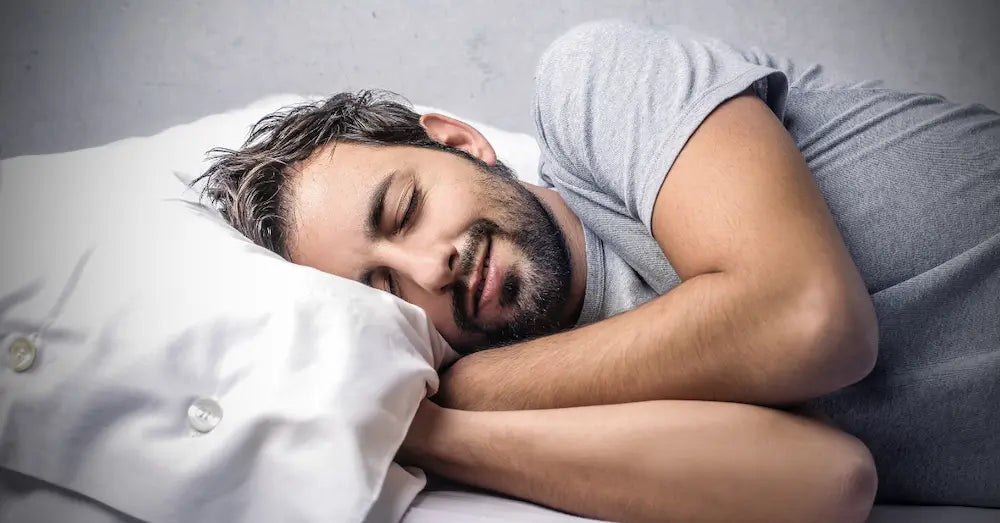 Man sleeping peacefully, used in blog about the best cannabis gummies for sleep and relaxation support.