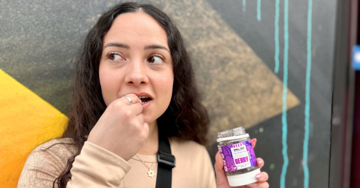 Lady enjoying "The Best Tasting THC Gummies" that take flavor to the next level 