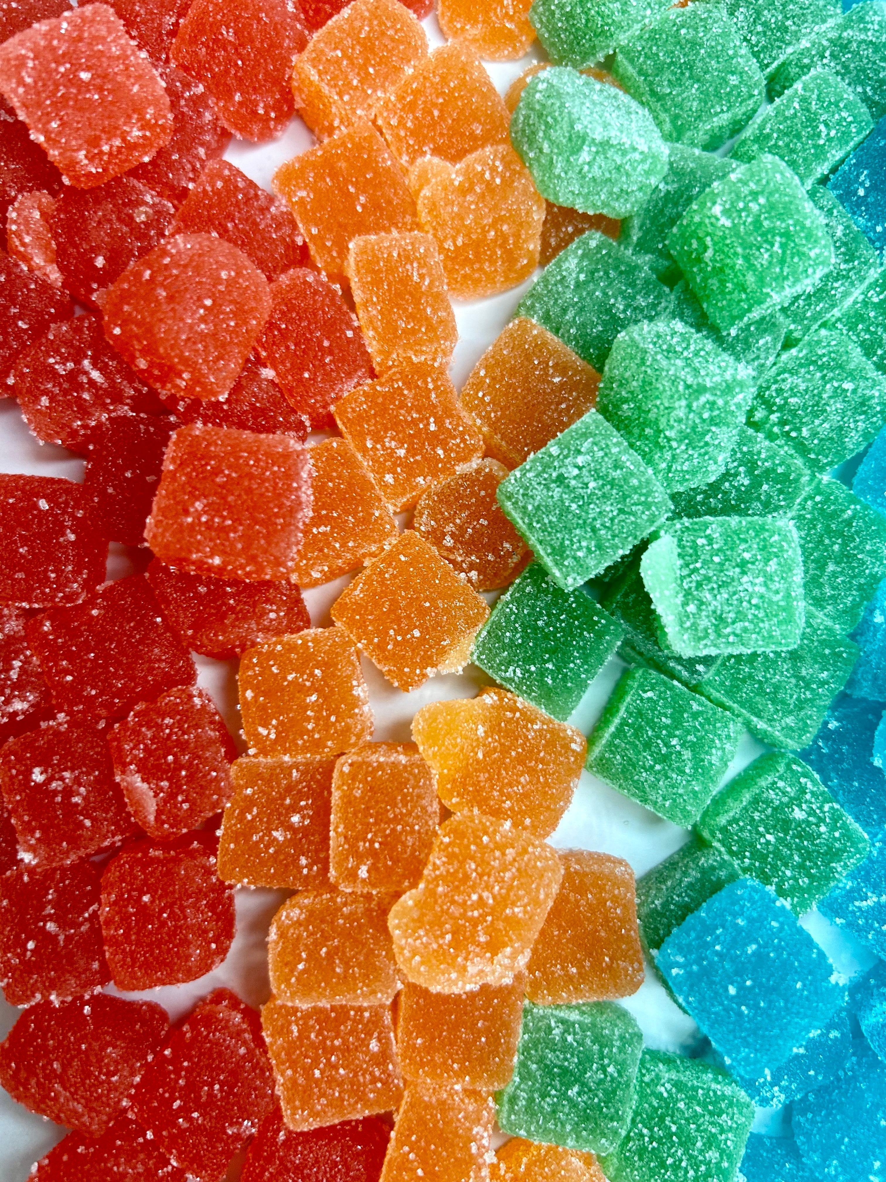 VEED THC Gummies in a blog about THC Gummies and constipation (flavored THC gummies: strawberry, peach mango, green apple, and blueberry cotton candy)