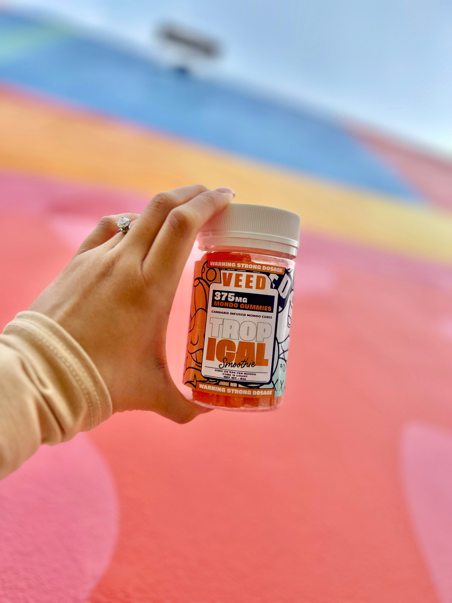 VEED gluten free cannabis edibles in the form of gummies presented in a container